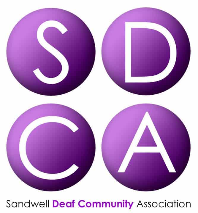 Four purple circles each containing a large white letter "S", "D", "C", and "A"; below, text reads "Sandwell Deaf Community Association".